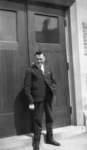 Man standing in front of Willison Hall doorway