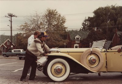 John Weir pushing a car