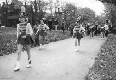 Ryerson majorettes and marching band in Waterloo College Homecoming Parade, 1955