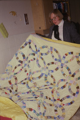 Tina Matiisen holding a quilt