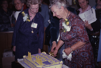Ruth Gillespie and Marie Ireland with the Women's Auxiliary anniversary cake