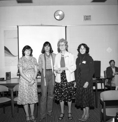 Flora Roy and three students