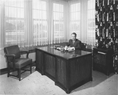 Lloyd Schaus sitting at a desk