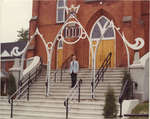 Norman Antler standing in front of Zion Lutheran Evangelical Church in Pembroke, Ontario