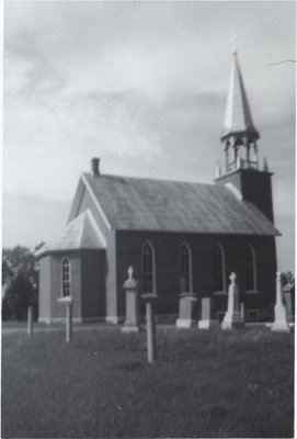 Exterior view of St. John's Evangelical Lutheran Church and cemetery in Augsburg, Ontario