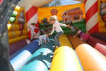 Children playing in a bounce house at Wilfrid Laurier University Homecoming game, 2005