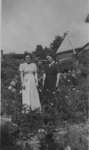 Erva Budd and a woman standing in a garden