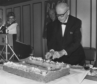 R.G. Geen cutting cake at Royal Canadian College of Organists National Convention, 1969