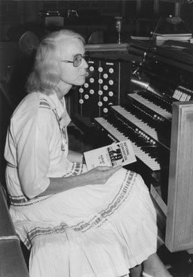 Carol Otto seated at organ