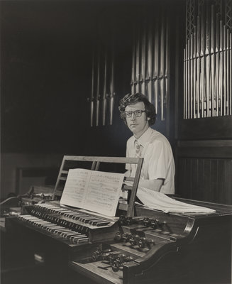 Peter Hurford seated at organ