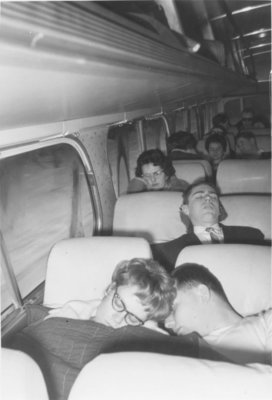 Waterloo Lutheran University Choir members sleeping on the tour bus