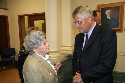 Max Blouw speaking to Mary Stedman at Laurier Brantford event