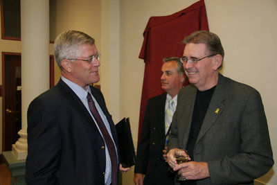 Max Blouw speaking to a man at a Laurier Brantford event