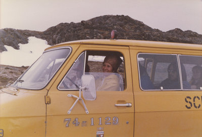 Marie Sanderson driving a van in Nunavut
