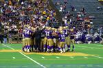 Football team huddle, Wilfrid Laurier University Homecoming game, 2003