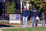Two students walking on campus, fall 2004