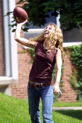 Student throwing a football on campus, 2004