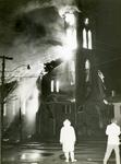 Fire fighter standing in front of fire at St. John's Lutheran Church