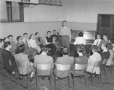 Ron Wilson leading a sing song at Waterloo College