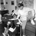Two Waterloo College students reading a book in dormitory room