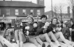 Waterloo College cheerleaders in Homecoming Parade, 1957