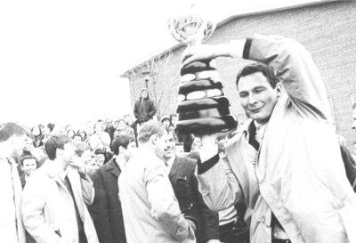 Waterloo Lutheran University basketball coach Howard &quot;Tex&quot; Lockhart with national championship trophy