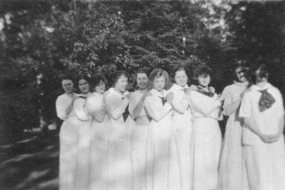 Young women in long dresses