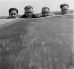 Four Waterloo College students on the roof of Willison Hall