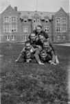 Waterloo College students forming a pyramid in front of Willison Hall