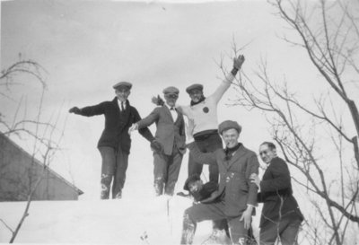 Waterloo College School students on top of a snowbank