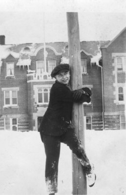 Arthur Mehlenbacher standing in the snow, in front of Willison Hall