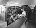 Student and staff in the Library in Willison Hall