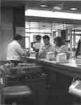 Wilfrid Laurier University Library staff members at Circulation Desk