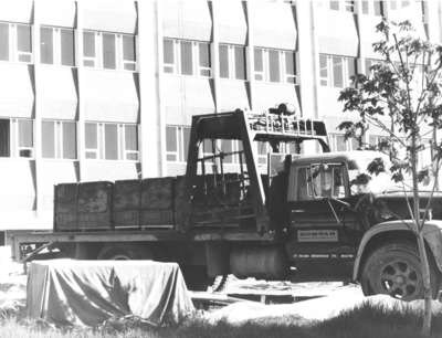 Truck parked at the Central Teaching Building construction site, Waterloo Lutheran University