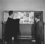 Professor George Durst and student Wilfred Myra in a classroom