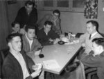 Men playing cards in Dining Hall, Waterloo College