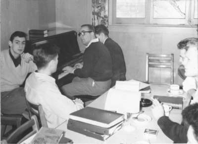 Two men playing piano in Dining Hall, Waterloo College