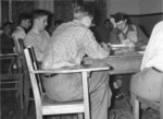 Men playing cards in Dining Hall, Waterloo College