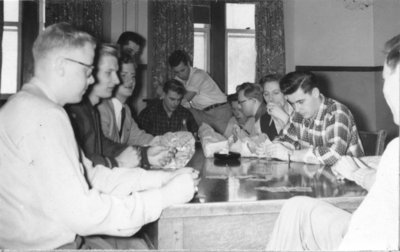 Men playing cards in Dining Hall, Waterloo College