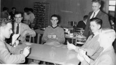 Men playing cards in the Dining Hall, Waterloo College