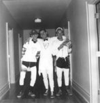 Three men standing in hallway, Waterloo College