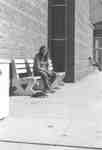 Woman sitting on a bench, Waterloo Lutheran University