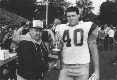 Tuffy Knight presents award at Wilfrid Laurier University Homecoming 1984