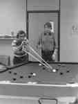 Two men playing pool