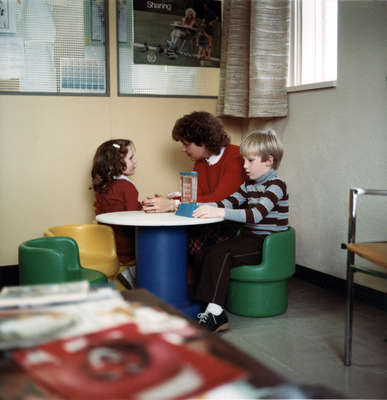 Faculty of Social Work student with two children