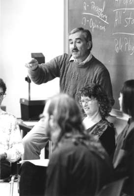 Robert Basso and students in classroom