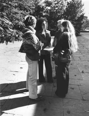 Four Wilfrid Laurier University students standing outdoors