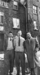 Three men standing in front of Willison Hall, Waterloo College