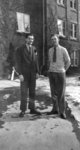 Two men standing in front of Willison Hall, Waterloo College