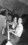 Two Waterloo College students playing piano